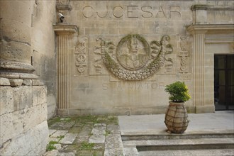 Relief and monument to Roman Emperor Julius Caesar with inscription, Hotel Jules César, Arles,