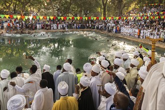 Ethiopian crowd at Timkat festival at Fasilides Bath in Gondar, Ethiopia, Africa