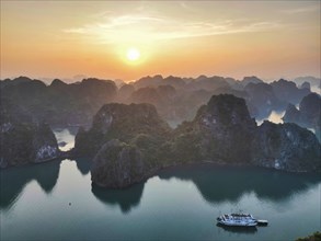 Halong Bay in Vietnam, a UNESCO World Heritage Site at sunset seen from above