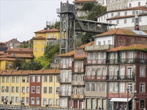 Several colourful buildings depicted on a hill in a city, Porto, Douro, Portugal, Europe