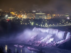 Niagara Falls lit at night seen from the Canadian side
