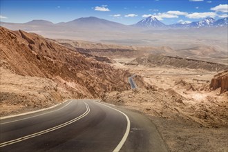 Road leading through the arid landscape at the Valley of the Moon in Chile