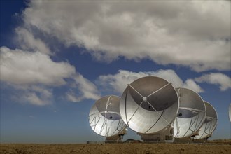 Four satellite dishes out of 60 of ESO's ALMA array pointed to the side