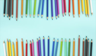 Color pencils collection in a row, back to school, drawing supplies, blue background with copy