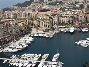 Inner harbour with tightly packed boats and surrounding buildings, monte carlo, monaco, france