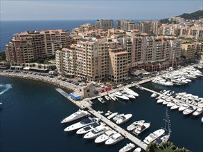 High view of the marina with numerous boats, surrounded by buildings, monte carlo, monaco, france