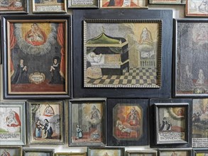 Votive pictures, votive tablets on the walls of the chapel of grace inside the church, pilgrimage