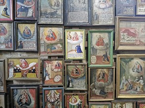 Votive pictures, votive tablets on the walls of the chapel of grace inside the church, pilgrimage