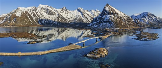 Aerial view of bridge, fjord, steep mountains, coast, winter, panorama, evening light, reflection,
