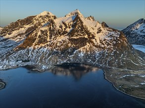 Aerial view of fjord, steep mountains, coast, winter, morning light, reflection, Moskenesoya,