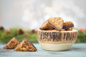 Nut corner triangles, traditional german sweets called Nussecke, covered with chocolate, christmas