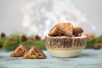 Nut corner triangles, traditional german sweets called Nussecke, covered with chocolate, christmas