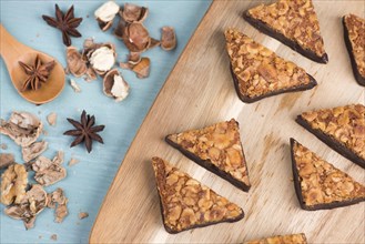 Nut corner, traditional german sweets called Nussecke, covered with chocolate, christmas baking