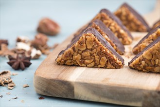 Nut corner, traditional german sweets called Nussecke, covered with chocolate, christmas baking