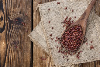 Dried red beans on dark rustic wooden background