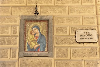 Montepulciano, Tuscany, Italy, Europe, Mural of the Madonna and Child, on a stone wall in a