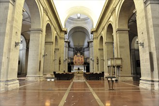 Montepulciano, Tuscany, Italy, Europe, A wide church interior with marble floor, large columns and