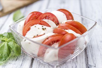 Tomatoes with Mozzarella Cheese (close-up shot, selective focus)