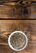 Heap of Hemp Seeds on wooden background (cloese-up shot)