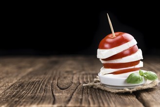 Mozzarella Cheese with fresh Tomatoes (selective focus) on vintage background