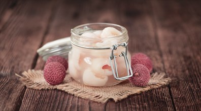 Preserved Lychees on a vintage background as detailed close-up shot (selective focus)