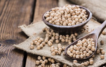 Portion of dried Chick Peas on an old wooden table