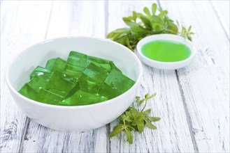 Fresh made Woodruff Jello (close-up shot) on wooden background