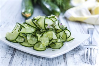 Fresh made Cucumber Salad in a bowl (close-up shot)