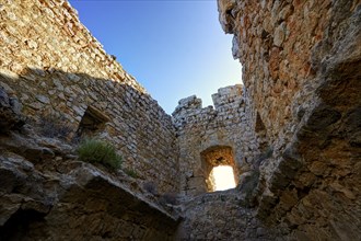 HDR, Interior view of the castle wall with a window-like hole through which sunlight enters,