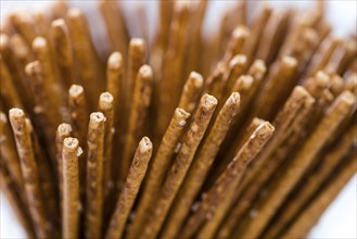 Salt Sticks (close-up shot) on bright wooden background