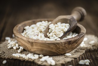 Wooden table with puffed Rice (detailed close-up shot)