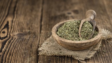 Portion of Stevia Leaves (dried, close-up shot) on wooden background