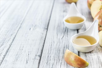 Portion of Applesauce (selective focus) on vintage background (close-up shot)