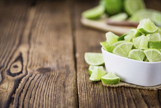 Portion of fresh Lime Slices (close-up shot, selective focus)