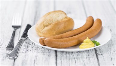 Wiener Sausages on a vintage background as detailed close-up shot (selective focus)