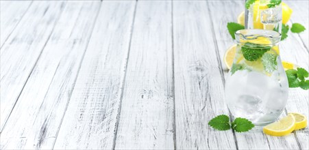 Lemonade on a vintage background as detailed close-up shot (selective focus)