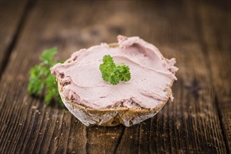 Liverwurst Sandwich on a vintage background as detailed close-up shot (selective focus)