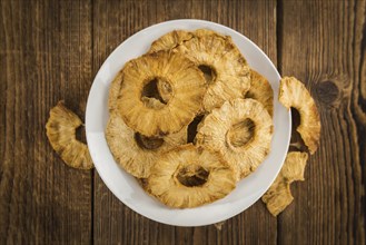 Some homemade Dried Pineapple Rings as detailed close-up shot, selective focus
