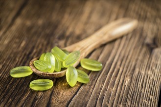 Gummy Candy with lime taste (selective focus) on wooden background