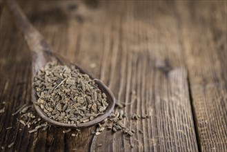 Dried Valerian roots (detailed close-up shot) on wooden background