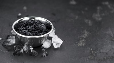Caviar on a vintage looking slate slab (selective focus)
