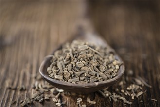 Valerian roots (dried, detailed close-up shot) on wooden background