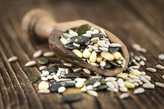 Heap of mixed Seeds (close-up shot) on wooden background