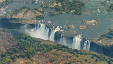 Victoria Falls at drought near Livingstone, Zimbabwe, as aerial shot made from a helicopter, Africa