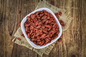 Goji Berries on a vintage background as detailed close-up shot (selective focus)