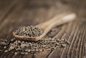 Dried Valerian roots (detailed close-up shot) on wooden background