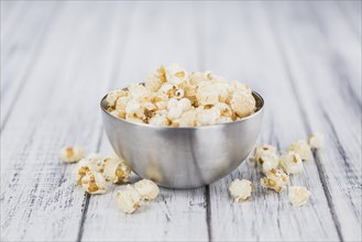 Some homemade Popcorn as detailed close-up shot, selective focus