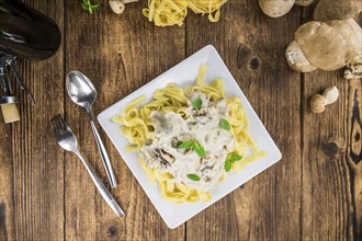 Porcini pasta on a vintage background as detailed close-up shot, selective focus