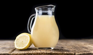 Lemon Juice on a vintage background as detailed close-up shot (selective focus)