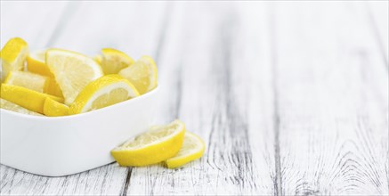 Lemon Slices on a vintage background as detailed close-up shot (selective focus)